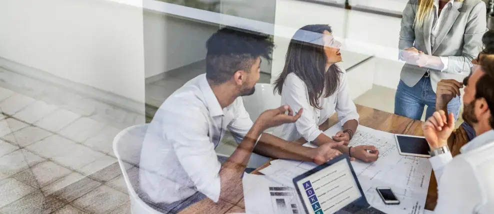 A group of young professionals in a laidback meeting